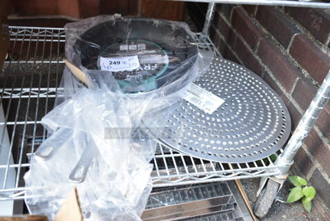 9 BRAND NEW SCRATCH AND DENT! Items Including 7 American Metalcraft 18916SP 16" Super Perforated Aluminum Pizza Disk and 2 Choice 407FRYPANS12 12" Aluminum Non-Stick Fry Pan. 9 Times Your Bid! 