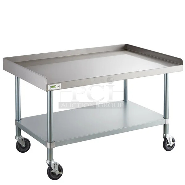 BRAND NEW SCRATCH AND DENT! Regency 600ES3048GK 30" x 48" 16 Gauge Stainless Steel Equipment Stand with Galvanized Undershelf and Casters. May Be Missing Pieces.  - Image 1 of 2