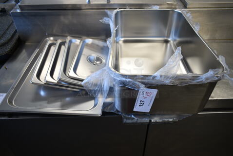 8 BRAND NEW SCRATCH AND DENT! Stainless Steel Items Including 2 176SSPILLFL Choice Full Size 6" Deep Stainless Steel Steam Table Spillage Pan, 5 4070130 Choice 1/3 Size Stainless Steel Solid Steam Table / Hotel Pan Cover, 4070110 Choice Full Size Stainless Steel Solid Steam Table / Hotel Pan Cover. 8 Times Your Bid! 