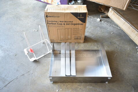 3 BRAND NEW SCRATCH AND DENT! Items Including 651PCORSS3 ServSense Adjustable 3-Section Stainless Steel Wall-Mount / Countertop 1.5 - 5.5 oz. Portion Cup / Lid Organizer, 208SCPHLDLG Choice Wall Mount Large Scoop Holder, ServSense Adjustable 4-Section Stainless Steel Wall-Mount / Countertop 1.5 - 5.5 oz. Portion Cup / Lid Organizer. 3 Times Your Bid! 