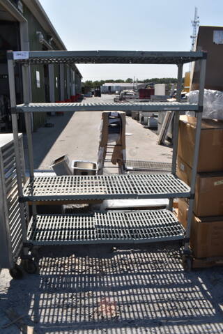 Metal and Poly 4 Tier Shelving Unit. BUYER MUST DISMANTLE. PCI CANNOT DISMANTLE FOR SHIPPING. PLEASE CONSIDER FREIGHT CHARGES.