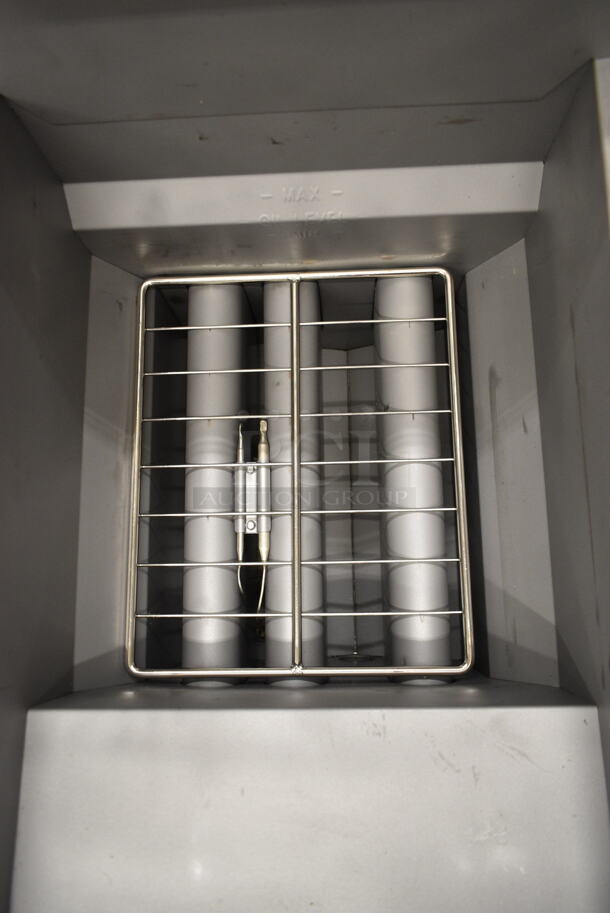 BRAND NEW SCRATCH AND DENT! 2023 Avantco 177FF40L Stainless Steel Commercial Floor Style Liquid Propane 40 lb. Stainless Steel Deep Fat Fryer w/ 2 Metal Fry Baskets and Commercial Casters. 90,000 BTU - Image 7 of 10