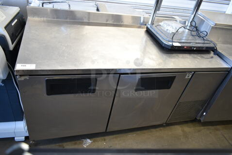 True TWT-67 Stainless Steel Commercial 2 Door Work Top Cooler on Commercial Casters. 1 Caster Needs Repair. 115 Volts, 1 Phase. Tested and Working!