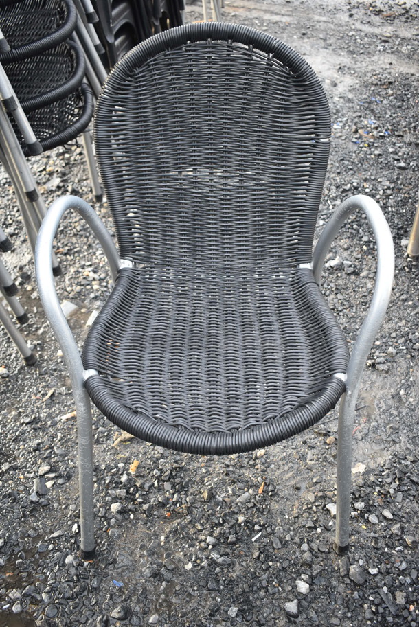 9 Black Wicker Style Chair w/ Arm Rests and Metal Frame. 21x25x32. 9 Times Your Bid!
