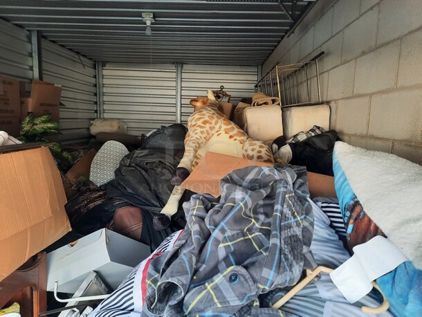 ALL ONE MONEY! Lot of Entire Contents of Storage Unit #29. Unit Size: 10 x 20. Unit Appears to Contain: Dressers, Bookshelves, Box Spring & Mattress, Wooden Bed, Couch, Chairs, Tables, Fan, Heaters, Bottle of Buttons, Longaberger Baskets, Lights, Mirror, Ironing Board, Rugs, Suitcases, Trashcan, Keurig, Blankets, Clothes, Shoes, Kerosene Heater, Large Stuffed Giraffe, Fake Plants, Bags, Totes & Boxes. Cleaning Deposit of $100 per Unit Paid on Pickup Day. Winner Has 7 Days From Close of Auction to Remove Items. All Items Must Be Removed and Unit Must Be Broom Swept to Get Cleaning Deposit Returned. Invoice and Cleaning Deposit Must Be Paid In Full by 4:00pm Tuesday, March 7th. Unit Must Be Cleared Out By 4:00pm Monday, March 13th. Please Come Into The Office To Settle Your Invoice and You Will Be Taken To Your Storage Unit for Cleanout. If You Plan To Clear Out Your Unit Saturday or Sunday You Need To Report To Our Office During The Week Before 4:00pm To Gain Access To Your Unit As Our Office Is Closed On Weekends. - Image 11 of 12