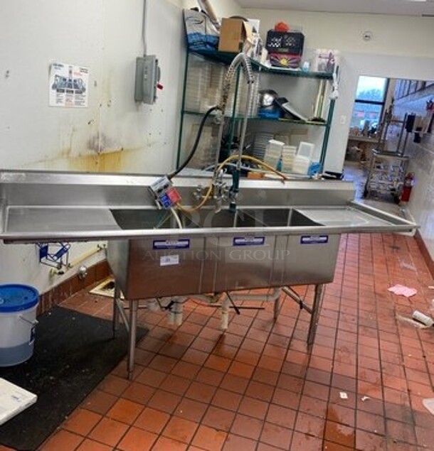 Commercial 3 Compartment Dish Washing Sink! With Dual Side Drain Board! With Back Splash! With Jet Spray, Faucet And Handles! All Stainless Steel! On Legs! - Image 1 of 8