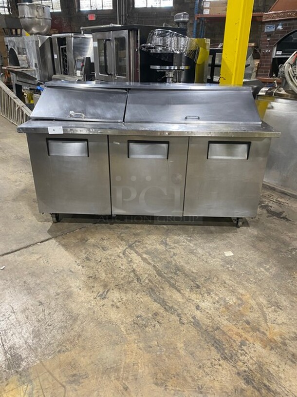 WOW! True Commercial Mega Top Refrigerated Sandwich/Salad Prep Table! All Stainless Steel! With 3 Door Refrigerated Storage Underneath! With Poly Coated Racks! On Casters! Model: TSSP72M! - Image 1 of 7