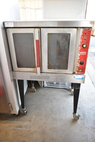 Vulcan VC4GD-64 Stainless Steel Commercial Full Size Convection Oven w/ View Through Doors, Metal Oven Racks, Thermostatic Controls and Metal Legs on Commercial Casters. 