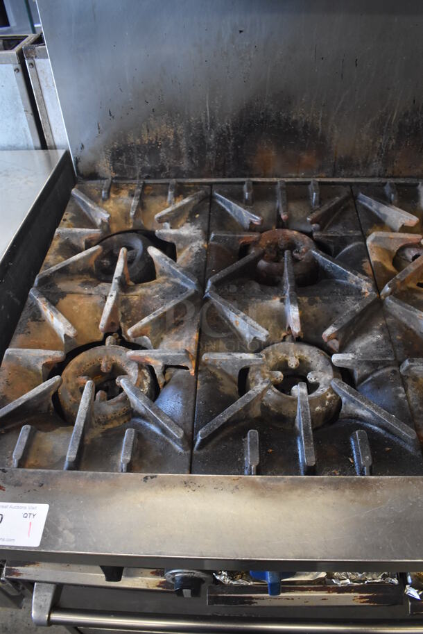 Garland SunFire Stainless Steel Commercial Natural Gas Powered 10 Burner Range w/ 2 Ovens, Over Shelf and Back Splash on Commercial Casters.  - Image 4 of 8