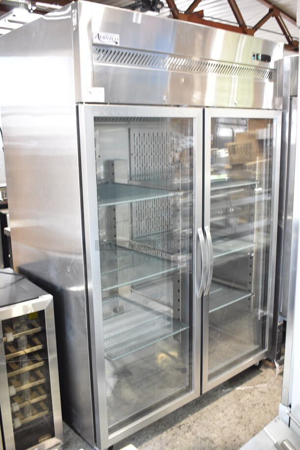 BRAND NEW SCRATCH AND DENT! 2023 Avantco 178Z2RGHC Stainless Steel Commercial 2 Door Reach In Cooler Merchandiser w/ Poly Coated Racks on Commercial Casters. See Pictures for Crack in Right Door. 115 Volts, 1 Phase. Tested and Powers On But Does Not Get Cold - Image 2 of 7