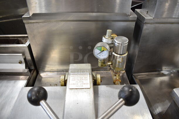 Henny Penny 600 Stainless Steel Commercial Floor Style Natural Gas Powered Pressure Fryer w/ Metal Fry Basket on Commercial Casters. 80,000 BTU.  - Image 8 of 10
