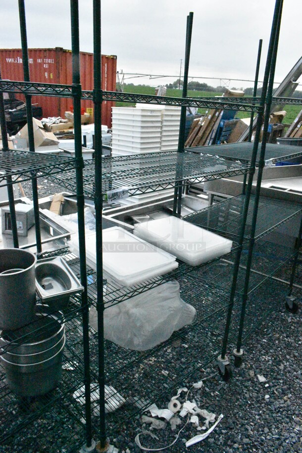 Green Finish 5 Tier Wire Shelving Unit on Commercial Casters w/ Contents Including Poly Lids and Poly Pitchers. BUYER MUST DISMANTLE. PCI CANNOT DISMANTLE FOR SHIPPING. PLEASE CONSIDER FREIGHT CHARGES.  - Image 1 of 8