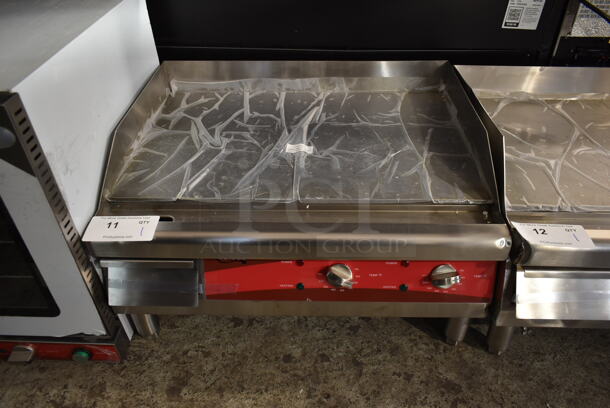 BRAND NEW SCRATCH AND DENT! Avantco 177EG24N Stainless Steel Commercial Countertop Electric Powered Flat Top Griddle. 208/240 Volts, 1 Phase.