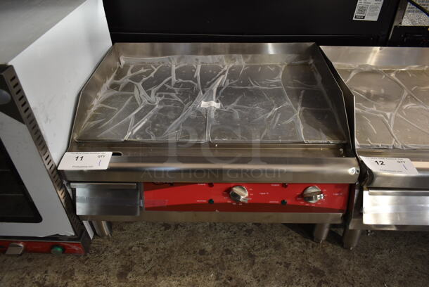 BRAND NEW SCRATCH AND DENT! Avantco 177EG24N Stainless Steel Commercial Countertop Electric Powered Flat Top Griddle. 208/240 Volts, 1 Phase. - Image 1 of 5
