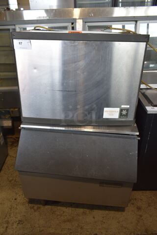 Manitowoc QY0604A Stainless Steel Commercial Ice Head on Scotsman Ice Bin. 208-230 Volts, 1 Phase. 