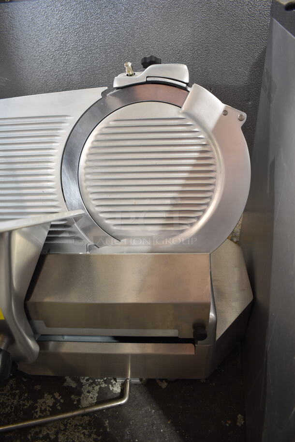 BRAND NEW SCRATCH AND DENT! Estella 348SLA13 Stainless Steel Commercial Countertop Automatic Meat Slicer w/ Blade Sharpener. 120 Volts, 1 Phase. Tested and Powers On But Parts Do Not Move
 - Image 3 of 8