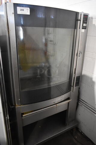 Fri-jado STG 7-P Stainless Steel Commercial Electric Powered Rotisserie Oven. 208 Volts, 3 Phase.