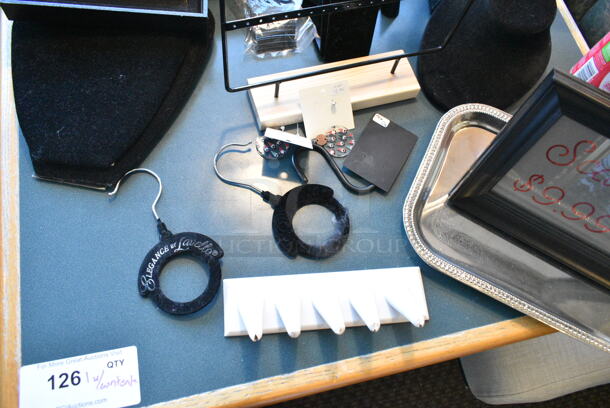 Wall Mount Table w/ Contents Including Jewelry Stands. BUYER MUST REMOVE: Bring Tools and Manpower Needed To Remove This Item. (booth room)  - Image 2 of 7