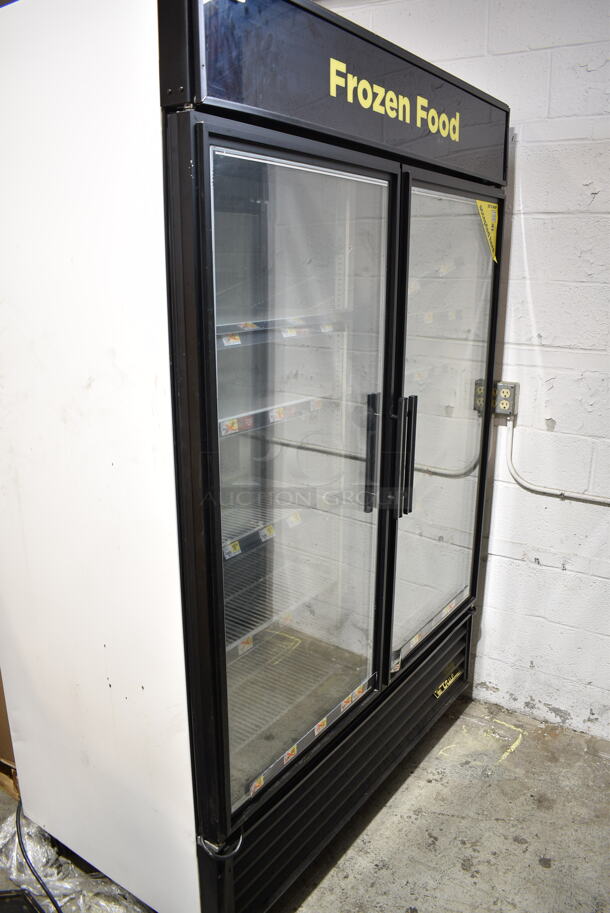 2015 True GDM-49F-LD ENERGY STAR Metal Commercial 2 Door Reach In Freezer Merchandiser w/ Poly Coated Freezer on Commercial Casters. 115/208-230 Volts, 1 Phase. Tested and Working! - Image 1 of 5