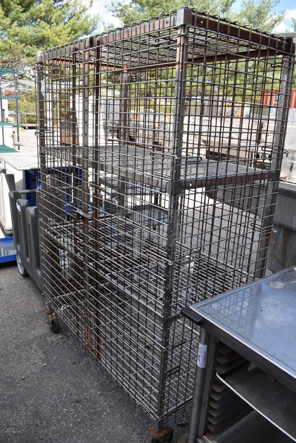 Chrome Finish 4 Tier Wire Shelving Unit w/ Liquor Cage on Commercial Casters. BUYER MUST DISMANTLE. PCI CANNOT DISMANTLE FOR SHIPPING. PLEASE CONSIDER FREIGHT CHARGES.  - Image 1 of 4