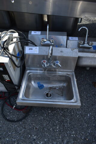 Stainless Steel Commercial Single Bay Wall Mount Sink w/ Faucet and Handles.