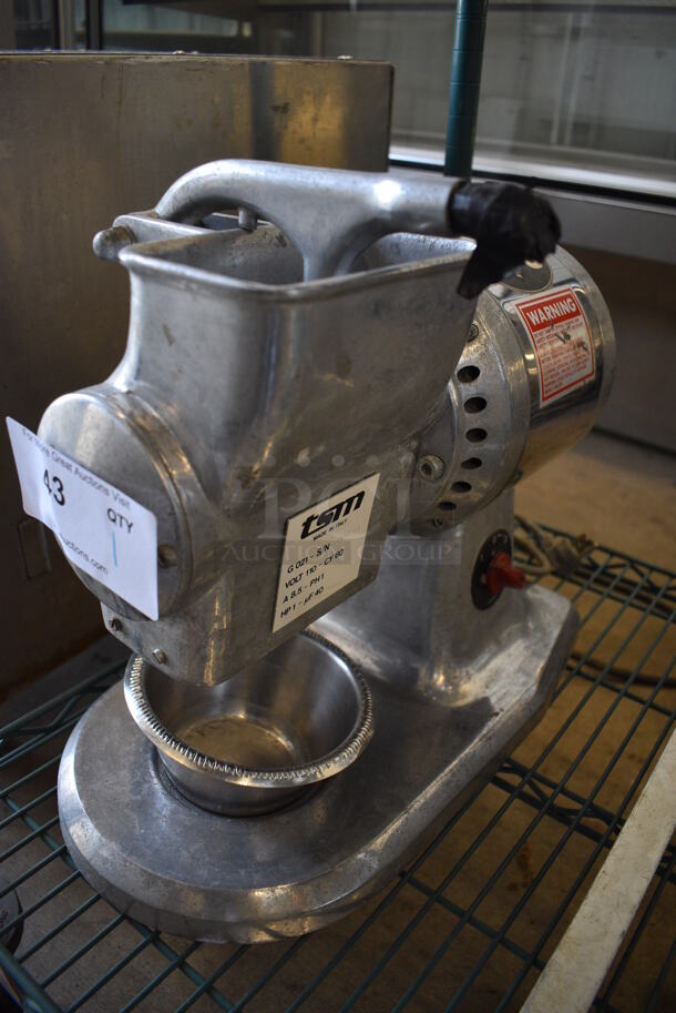 TSM Model G 021 Metal Commercial Countertop Grinder. 110 Volts, 1 Phase. 9.5x17x14.5. Tested and Powers On But Parts Do Not Move