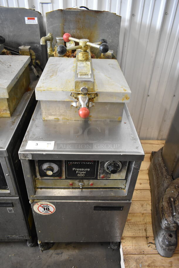 Henny Penny 600 Stainless Steel Commercial Floor Style Natural Gas Powered Pressure Fryer on Commercial Casters. 80,000 BTU.