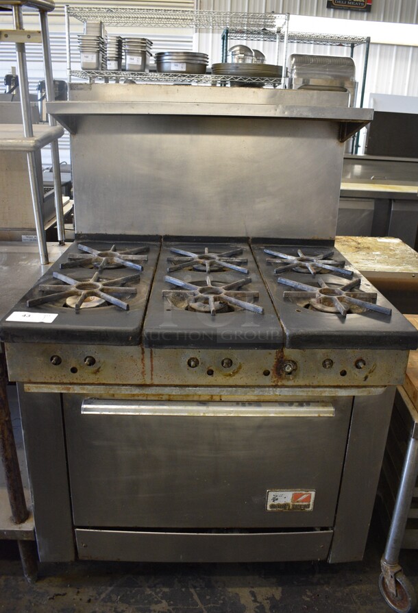 Southbend Stainless Steel Commercial Natural Gas Powered 6 Burner Range w/ Oven, Over Shelf and Back Splash. 37x32x57.5