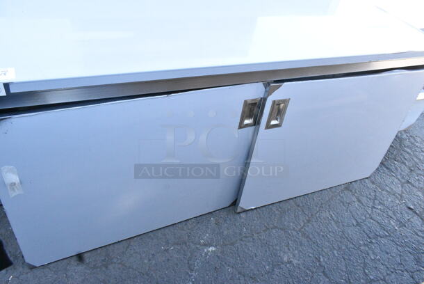 BRAND NEW SCRATCH AND DENT! Regency 600EBTB3072D 30" x 72" 16 Gauge Type 304 Stainless Steel Enclosed Base Sliding Door Table with Adjustable Midshelf and 6" Backsplash - Image 8 of 10