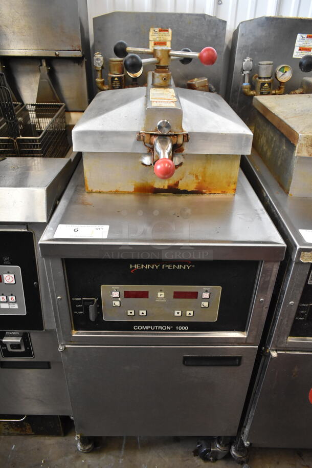Henny Penny 500 Stainless Steel Commercial Floor Style Electric Powered Pressure Fryer w/ Metal Fry Basket on Commercial Casters. 208 Volts, 3 Phase. 