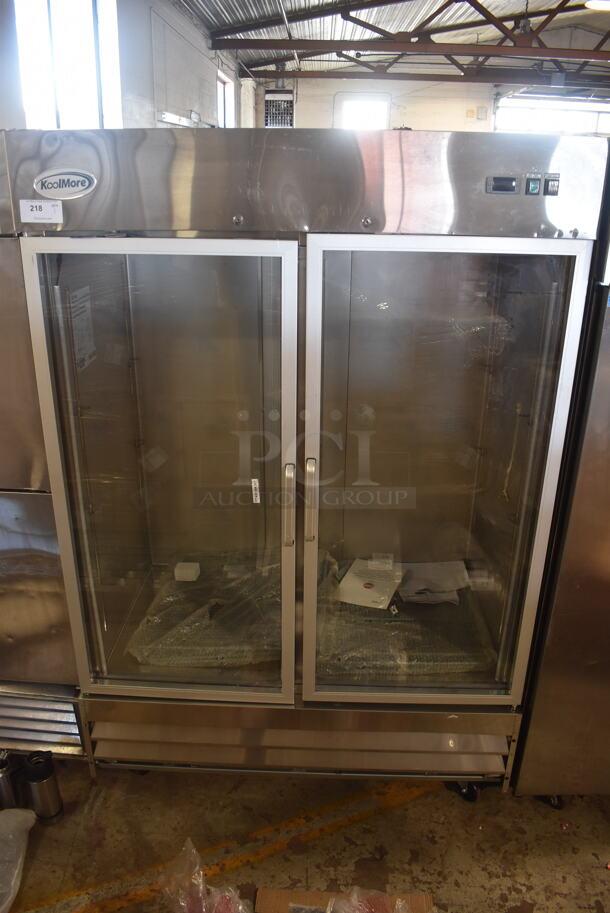 BRAND NEW SCRATCH AND DENT! KoolMore RIR-2D-GD Stainless Steel Commercial 2 Door Reach In Cooler Merchandiser w/ Poly Coated Racks on Commercial Casters. 115 Volts, 1 Phase. Tested and Working!