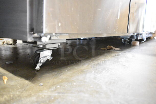 BRAND NEW SCRATCH AND DENT! 2024 Avantco 178SSUC48FHC Stainless Steel Commercial 2 Door Undercounter Freezer on Commercial Casters. 115 Volts, 1 Phase. Tested and Working! - Image 4 of 7