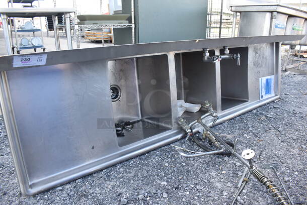 Stainless Steel Commercial 3 Bay Sink w/ Faucet, Handles, Spray Nozzle and Dual Drain Boards. Missing 1 Leg. 93x26x45. Bays 16x19x13. Drain Board 19x21x1 - Image 1 of 4