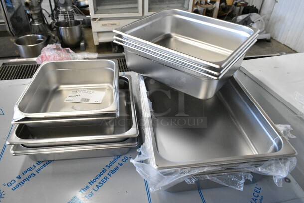11 BRAND NEW SCRATCH AND DENT! Stainless Steel Drop In Bins Including 2 4070249 Choice 1/2 Size 4" Deep Anti-Jam Stainless Steel Steam Table / Hotel Pan - 24 Gauge, 3 4070122 Choice 2/3 Size 2 1/2" Deep Anti-Jam Stainless Steel Steam Table / Hotel Pan - 24 Gauge, 3 4070142 Choice 2/3 Size 4" Deep Anti-Jam Stainless Steel Steam Table / Hotel Pan - 24 Gauge, 4 4070049 Choice Full Size 4" Deep 24 Gauge Anti-Jam Stainless Steel Steam Table / Hotel Pan. 11 Times Your Bid!  - Image 1 of 12