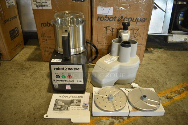 BRAND NEW SCRATCH AND DENT! Robot Coupe Model R 301 U Series D Metal Commercial Countertop Food Processor w/ Bowl, Lid, S Blade, Slicing Blade, Grating Blades and Continuous Feed Head Attachment. 120 Volts, 1 Phase. 8x12x17. 8.5x13x14. Tested and Working!