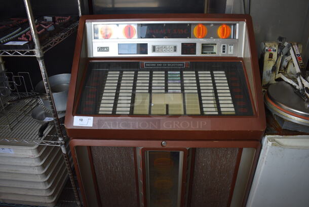 AMI Metal Commercial Floor Style Jukebox. 41x27x54. Tested and Powers On - Cannot Test Without Key - Image 2 of 7