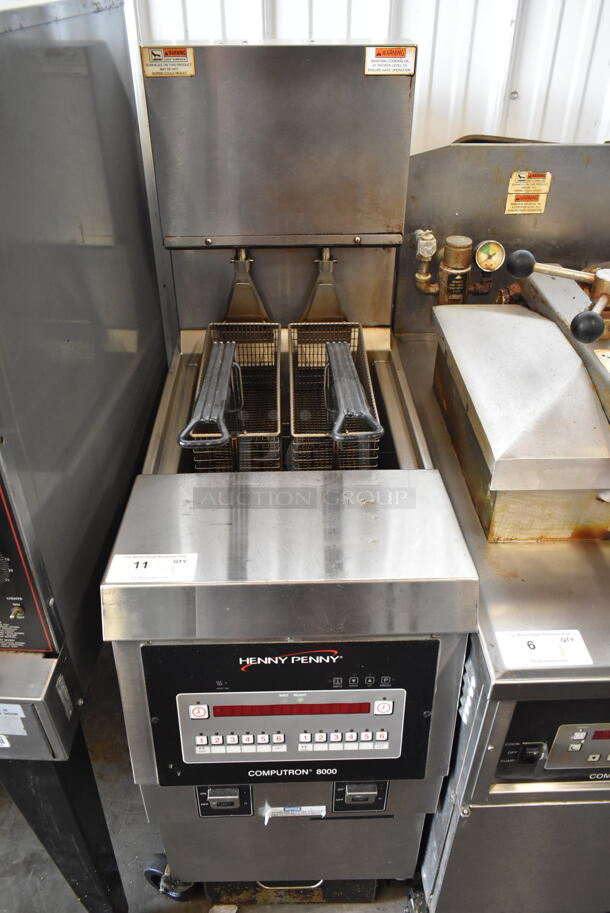 Henny Penny OEA-F Stainless Steel Commercial Floor Style Electric Powered Deep Fat Fryer w/ 2 Metal Fry Baskets on Commercial Casters. 208 Volts, 3 Phase. 