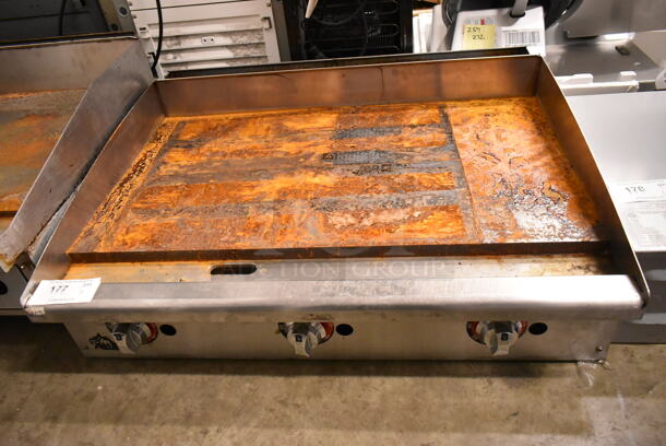 APW Wyott Stainless Steel Commercial Countertop Natural Gas Powered Flat Top Griddle. - Item #1113289