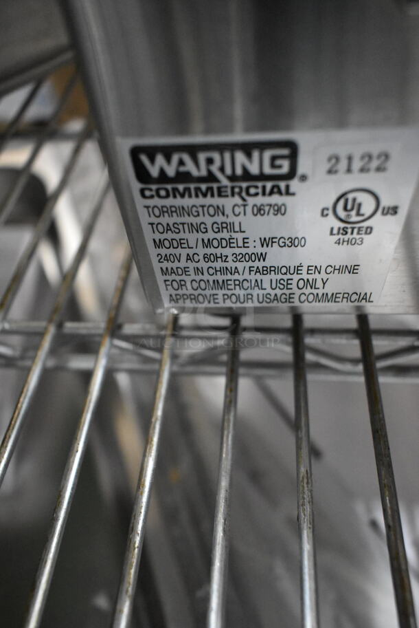 BRAND NEW SCRATCH AND DENT! Waring WFG300 Stainless Steel Commercial Countertop Tostato Ottimo Smooth Top & Bottom Dual Panini Press Sandwich Grill - 17" x 9 1/4" Cooking Surface. 240 Volts, 1 Phase.  - Image 6 of 6