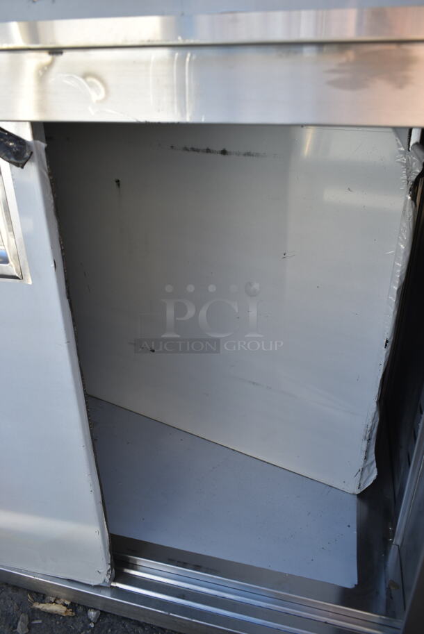 BRAND NEW SCRATCH AND DENT! Regency 600EBTB3072R 30" x 72" 16 Gauge Type 304 Stainless Steel Enclosed Base Sliding Door Table with Drawers and 6" Backsplash - Image 6 of 9