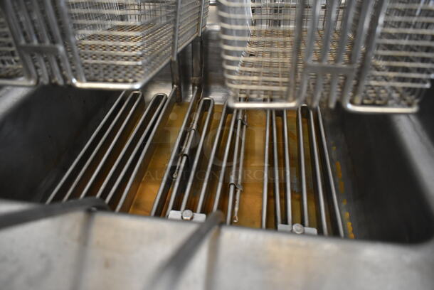 Wells F1016 Stainless Steel Commercial Electric Powered Deep Fat Fryer w/ 2 Metal Fry Baskets and Under Shelf. 208 Volts.  - Image 7 of 7