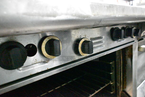 Garland M44R Stainless Steel Commercial Floor Style Natural Gas Powered 4 Burner Range w/ Oven, Over Shelf and Back Splash on Commercial Casters.  - Image 4 of 7