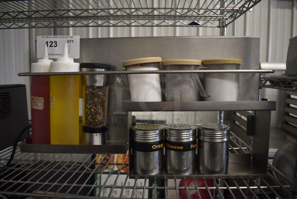 Metal Unit w/ 2 Condiment Bottles, 3 Poly Seasoning Shakers, 3 Metal Seasoning Shakers and Pepper Grinder. 20x5x12 - Image 1 of 2