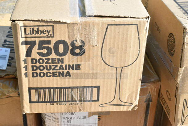 9 BRAND NEW Boxes Including 164TB2222 Lancaster Table & Seating 22" x 22" Cross Cast Iron Table Base Plate, 808B1449ACD Superlevel Self Adjusting Table Foot - 4/Pack, 407KRPLAS13 Choice 13-Slot Plastic Wall Mount Knife Rack, 2 Box Libbey 7508 Vina 12.75 oz. Customizable Tall Wine Glass - 12/Case, 117321310 AllPoints 32-1310 5' x 1/2" ID Fryer Oil Filter Hose, 4558022026 32 oz. Tall Plastic Iced Tea Design Souvenir Cup with Straw and Lid - 200/Case. 9 Times Your Bid!  - Image 6 of 11