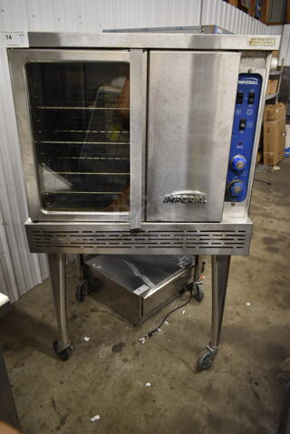 Imperial ICVG-1 Stainless Steel Commercial Natural Gas Powered Full Size Convection Oven w/ View Through Door, Solid Door, Metal Oven Racks, Thermostatic Controls and Metal Legs on Commercial Casters.