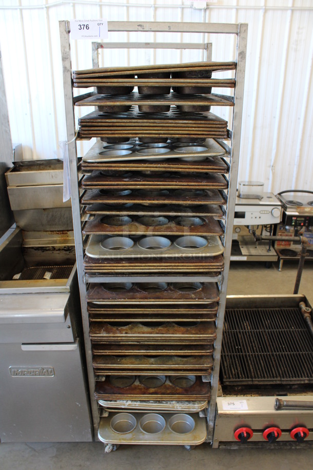 Metal Commercial Pan Transport Rack w/ 48 Metal 12 Cup Muffin Baking Pans on Commercial Casters. 20.5x26x68.5. Pans 18x26x1.5