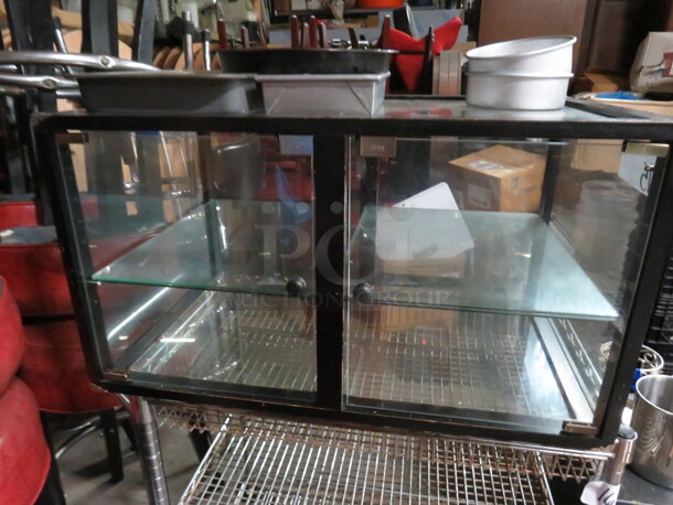 One 2 Door Wood/Glass Display Case With 1 Shelf. 30X19.5X16.5