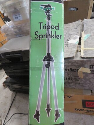 One NEW Tripod Sprinkler.