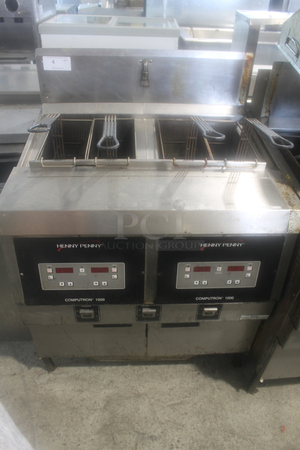 Henny Penny OFG 322 Stainless Steel Commercial Floor Style Propane Gas Powered 2 Bay Deep Fat Fryer w/ 4 Metal Fry Baskets. 170,000 BTU. - Image 1 of 8