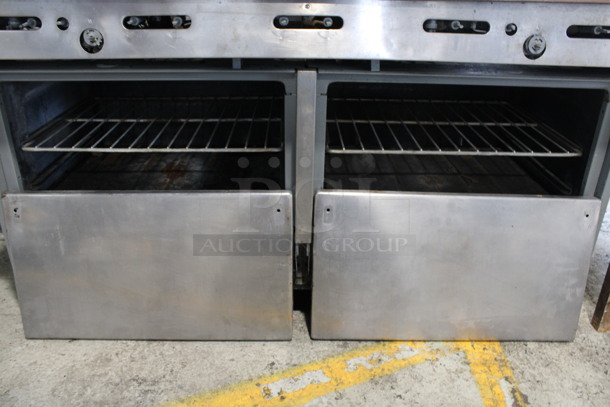 Garland Stainless Steel Commercial Propane Gas Powered 6 Burner Range w/ Flat Top Griddle, 2 Ovens, Over Shelf and Back Splash. Oven Doors and Door Handles Are Not Attached. Unit Appears To Have Been In The Process of Being Refurbished. 60x32x58 - Image 2 of 6